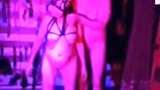 Dom Gresopio in Shibari Corset with Clothing and Mask