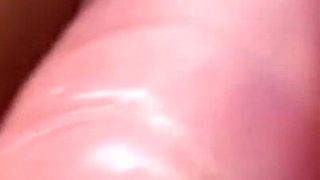 Sexy brunette masturbating with her dildo toy in close up