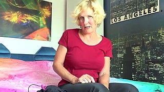 Beautiful mommy is alone on her bed masturbating