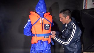 Ronja Being Tied And Gagged Overhead Wearing Sexy Shiny Nylon Rainwear And A Lifevest Being Lifted Up And Dominated By Stella (Video)