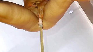 Incredible - Beautiful stepmother masturbates in the kitchen with a broomstick