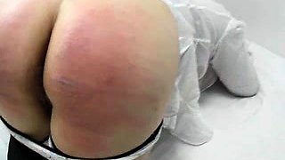 Amateur girl bends over and gets her lovely ass spanked hard