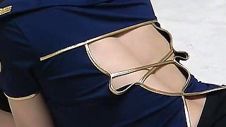 Busty Flight Attendant in No Bra, Miniskirt, Wedgie Thong Panties, and Stockings During Sexy Fitness Training in Apartment