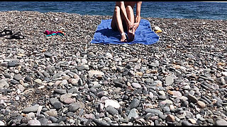 Cute exhibitionist girl get naked in public beach