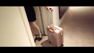 MILF in Stockings and Heels Walks Through the Corridors of a Hotel