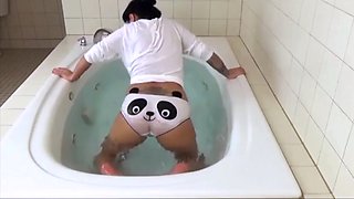 Farting up a storm in her bathtub