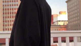 Ebony babe plays with a vibrator on a rooftop showing you her beefy lips