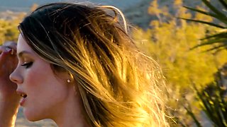 Big ass MILF strips naked in a desert