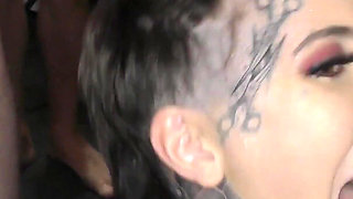 Hot Babe with an Amazing Tattoed Body Enters a Bukkake Party