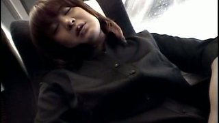 Short haired Japanese coed girl fingers her wet pussy in the train