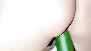 Big ass girl with tight pussy tries to fit a huge cucumber in her tight pussy