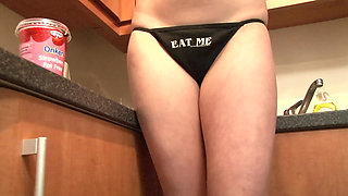 Blonde babe with big tits gets naked in the kitchen