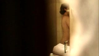 Voyeur spying on a busty amateur Japanese babe in the shower