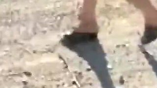 Mel walking on the side of the road