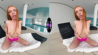 A red-haired beauty, Holly Molly, caresses her slim body.
