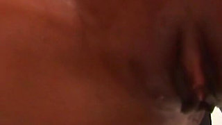 Oiled ebony babe masturbates with her fingers and toy in a close up video