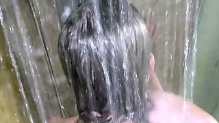 Brunette doggystyled in a shower