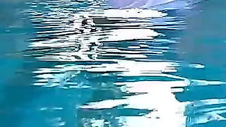 Couple Underwater Diving and Swimming