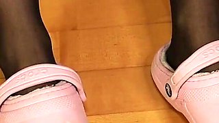 Ripped Black Thigh Highs in Worn Pink Clogs - Under Desk View