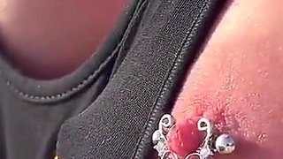 Boobs and Pierced Nipples Playing on the Beach