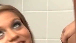 Willing in the bathroom with two cocks to do