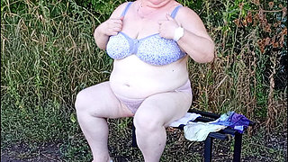 Stepmom in the Park Undressing and Masturbating on a Bench