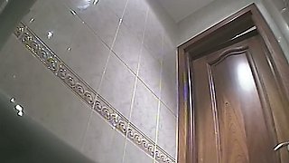 Blonde white milf in the toilet room shows her ass on hidden cam