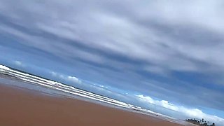 A couple of naughty babes got into a small orgy on the beach