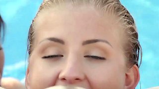 Lesbians who caress each other in the pool