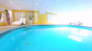 Blonde Enjoys Solo Play in a Pool