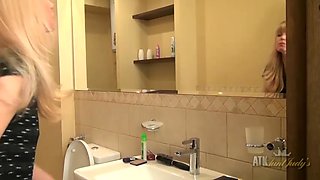 Natalia pees in the toilet and fingers her clit