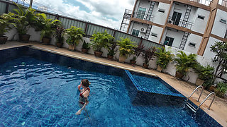 watch us playing in our swimming pool