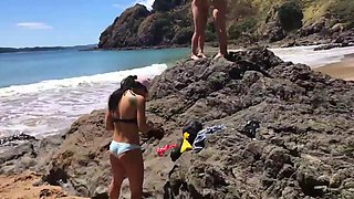 Horny babes masturbating on the beach