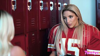Attractive busty cheerleaders have fun teasing each other in the locker room