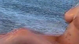 Busty Adrianne Playing on Beach.