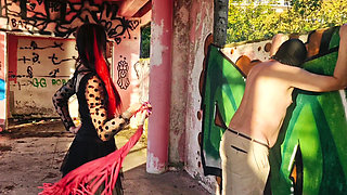 BDSM femdom flogging. Dominatrix Nika punishes her slave at sunset in an abandoned building. Back scratching.