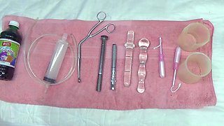 Lesbian piss inside the Uterus of other with tube in PeeHole