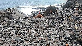 Short-haired tattooed girlfriend gives outdoor beach blowjob