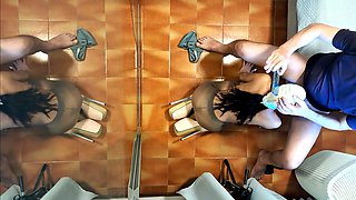 Naked milf in pantyhose and heels gives a blowjob while sipping a drink