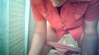 Lovely blondie in the toilet room got her pussy flashed on hidden cam