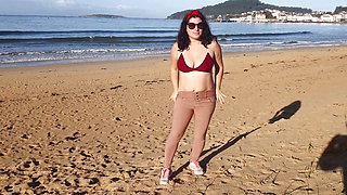 Woman Pissing on a Public Beach While No One Is There