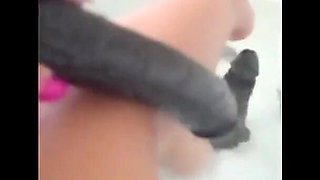 MILF Plays in the Tub with a Big Dildo