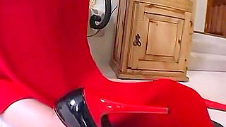 Dressed in red, Mika Tan takes anal punishment