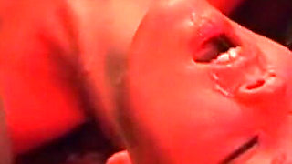 Mature Redhead Squirts Wildly in Intense Group Domination Session