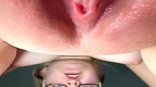 A Sexy Blonde Wearing Glasses Orgasms Over the Camera