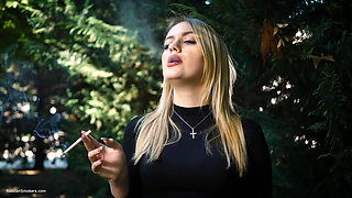 Hot Blonde Babe Smoking One Black Cigarettes in Nature