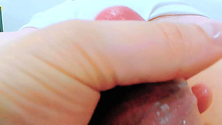 Rubbing her innocent cunt, she opens her lips