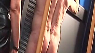 Dominatrix Trains Hooded Slave with Huge Dildo