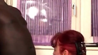Redhead old boss is fucked by black help with a big cock in the office