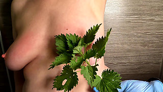 Nettle Punishment on Her Naked Tits